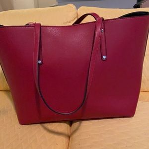 INC red handbag